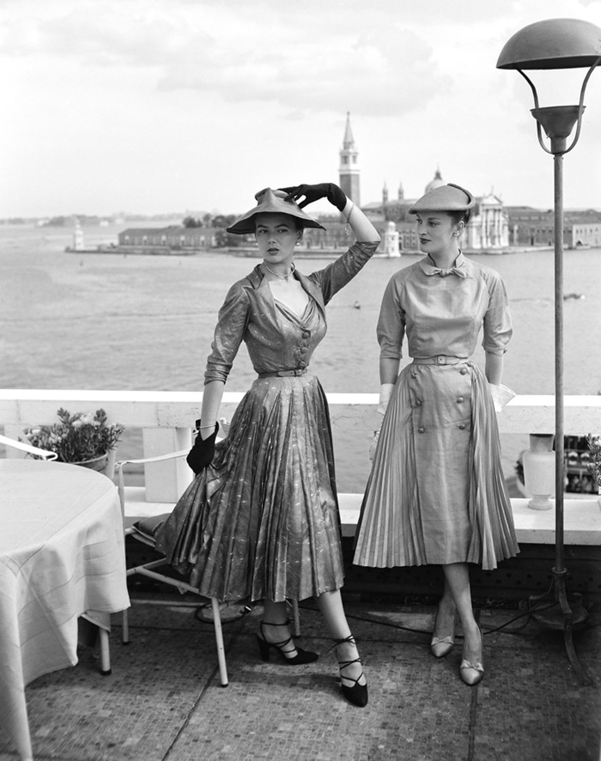 Models wearing Christian Dior fashions near the Piazza San Marco in Venice, 3rd June 1951. The island of San Giorgio Maggiore is visible in the background. (Photo by Archivio Cameraphoto Epoche/Getty Images)
